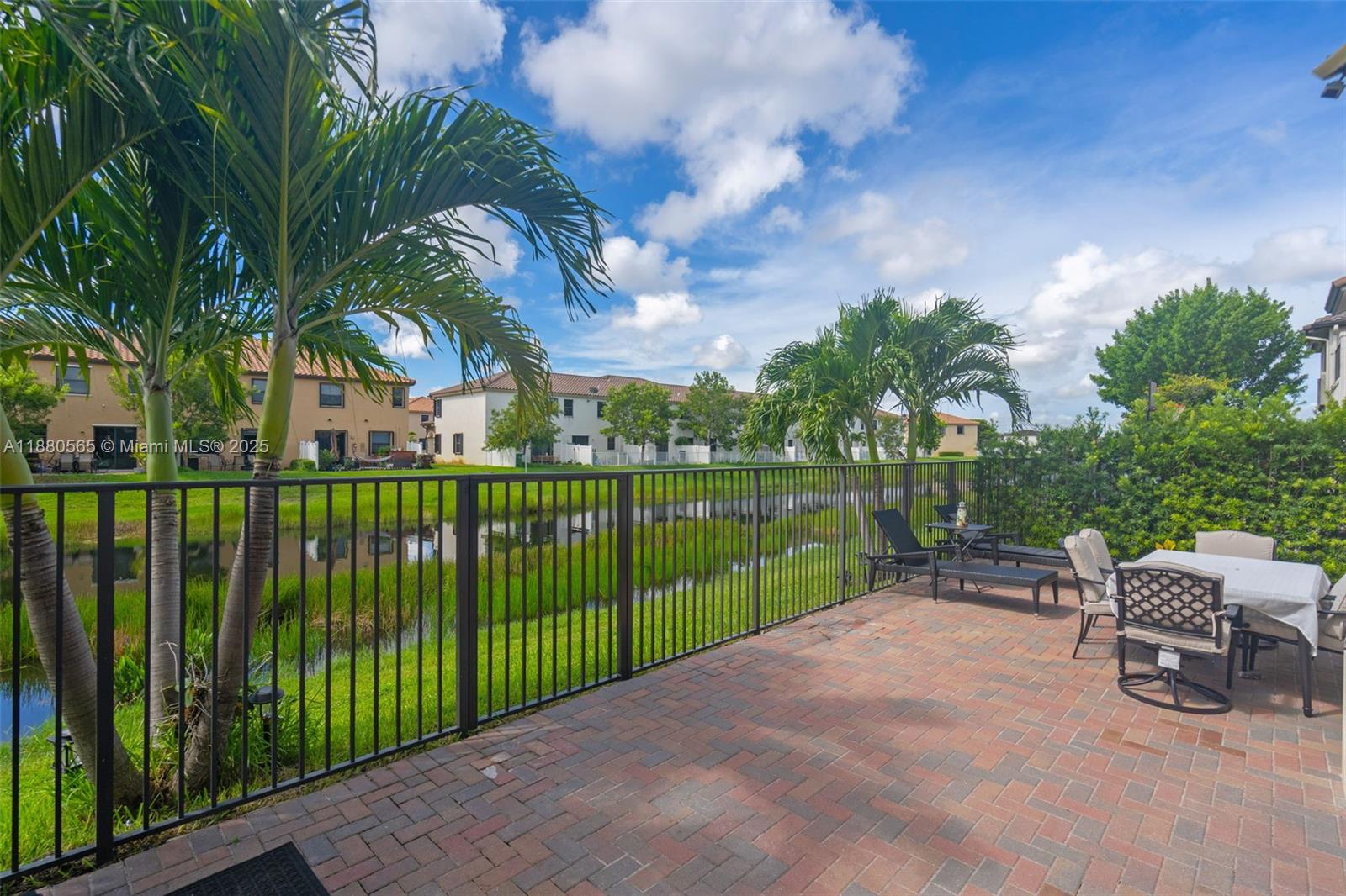 3332 West 95th Terrace, Unit 3332 Hialeah, FL 33018 - Photo 14 of 31 a view of a patio with a backyard