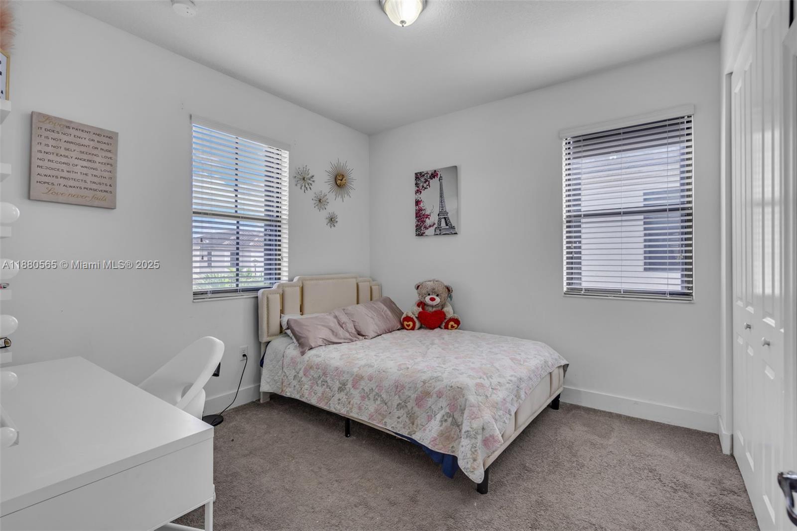 3332 West 95th Terrace, Unit 3332 Hialeah, FL 33018 - Photo 18 of 31 a bedroom with a bed and a window