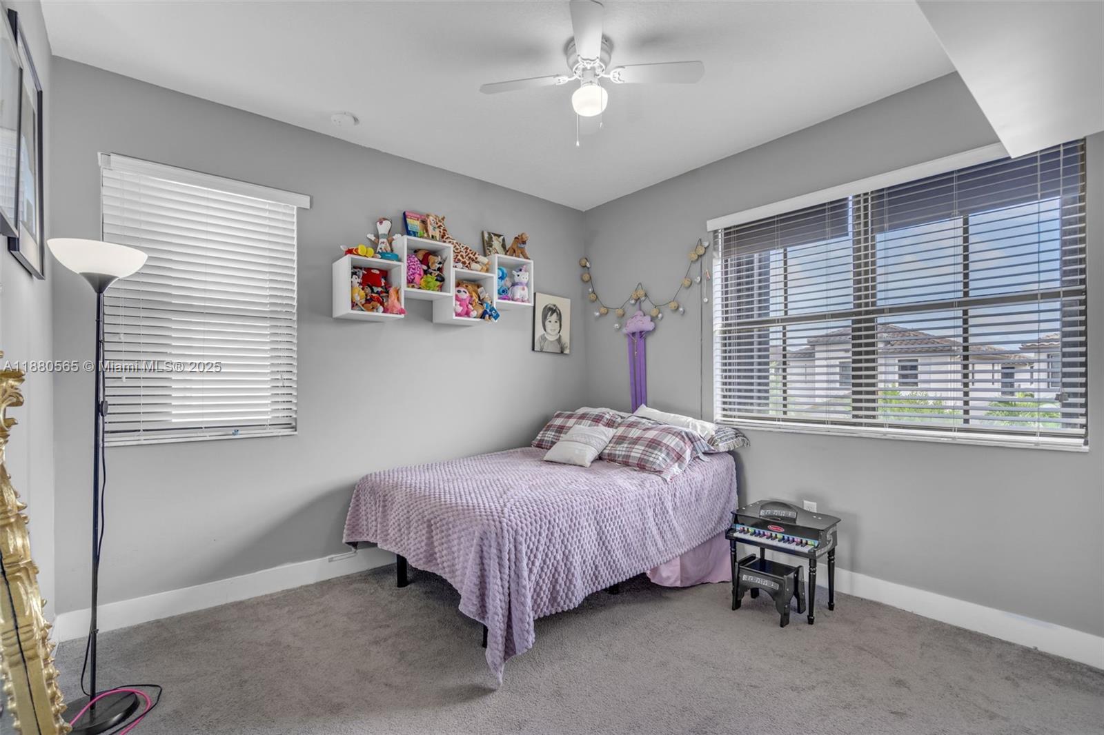 3332 West 95th Terrace, Unit 3332 Hialeah, FL 33018 - Photo 19 of 31 a bedroom with a bed and a window