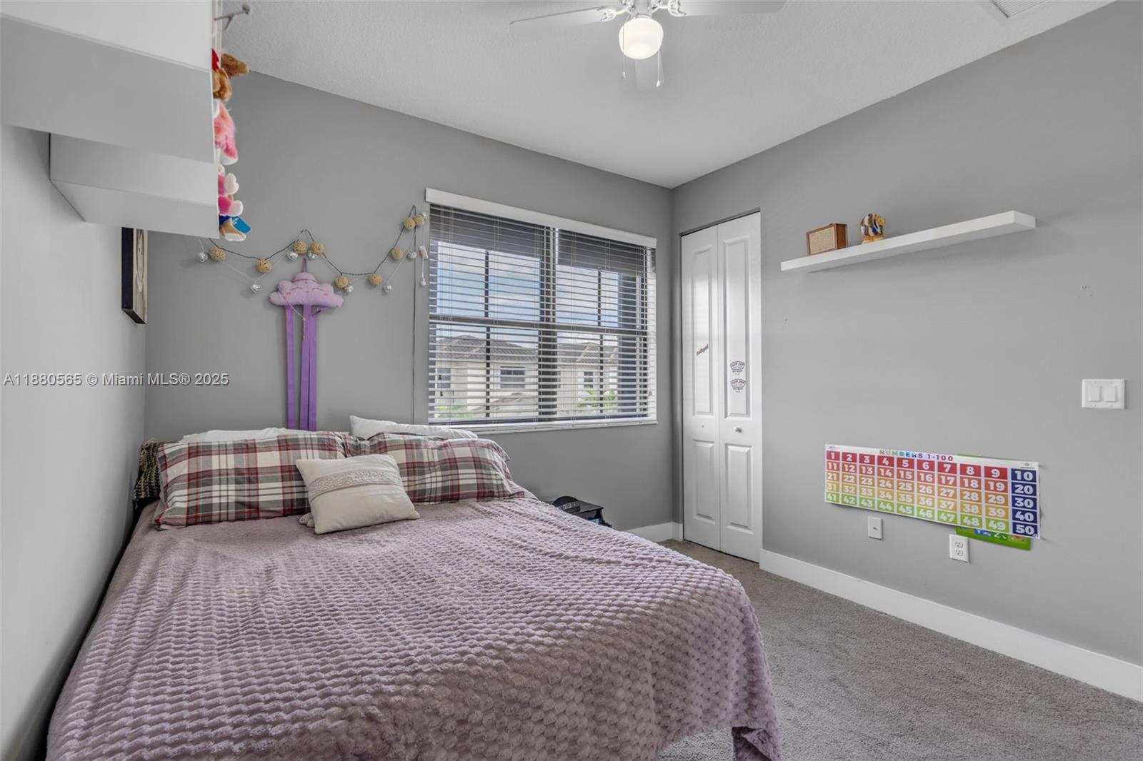 3332 West 95th Terrace, Unit 3332 Hialeah, FL 33018 - Photo 20 of 31 a bedroom with a bed and a window