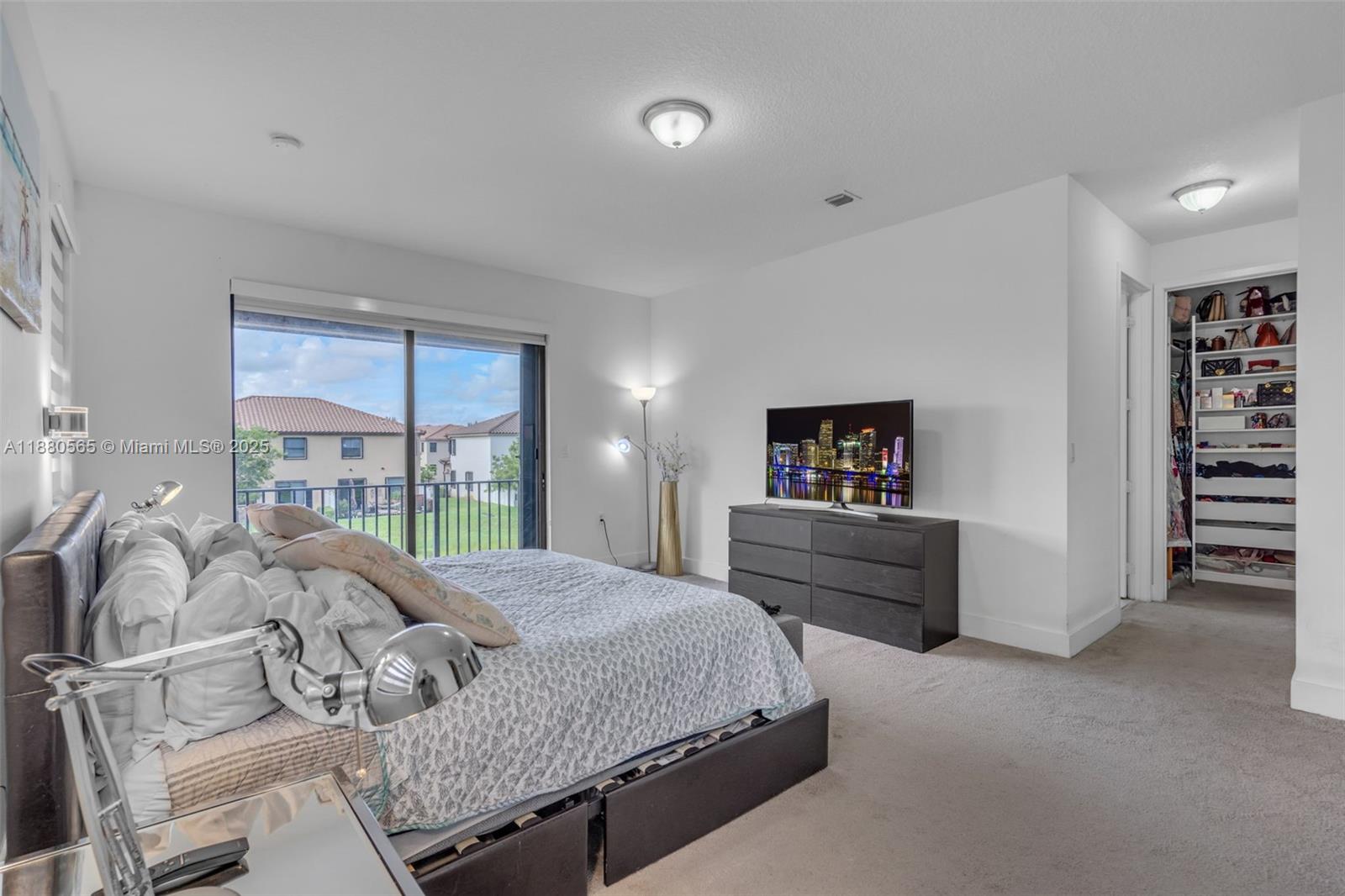 3332 West 95th Terrace, Unit 3332 Hialeah, FL 33018 - Photo 22 of 31 a bedroom with a bed and a window