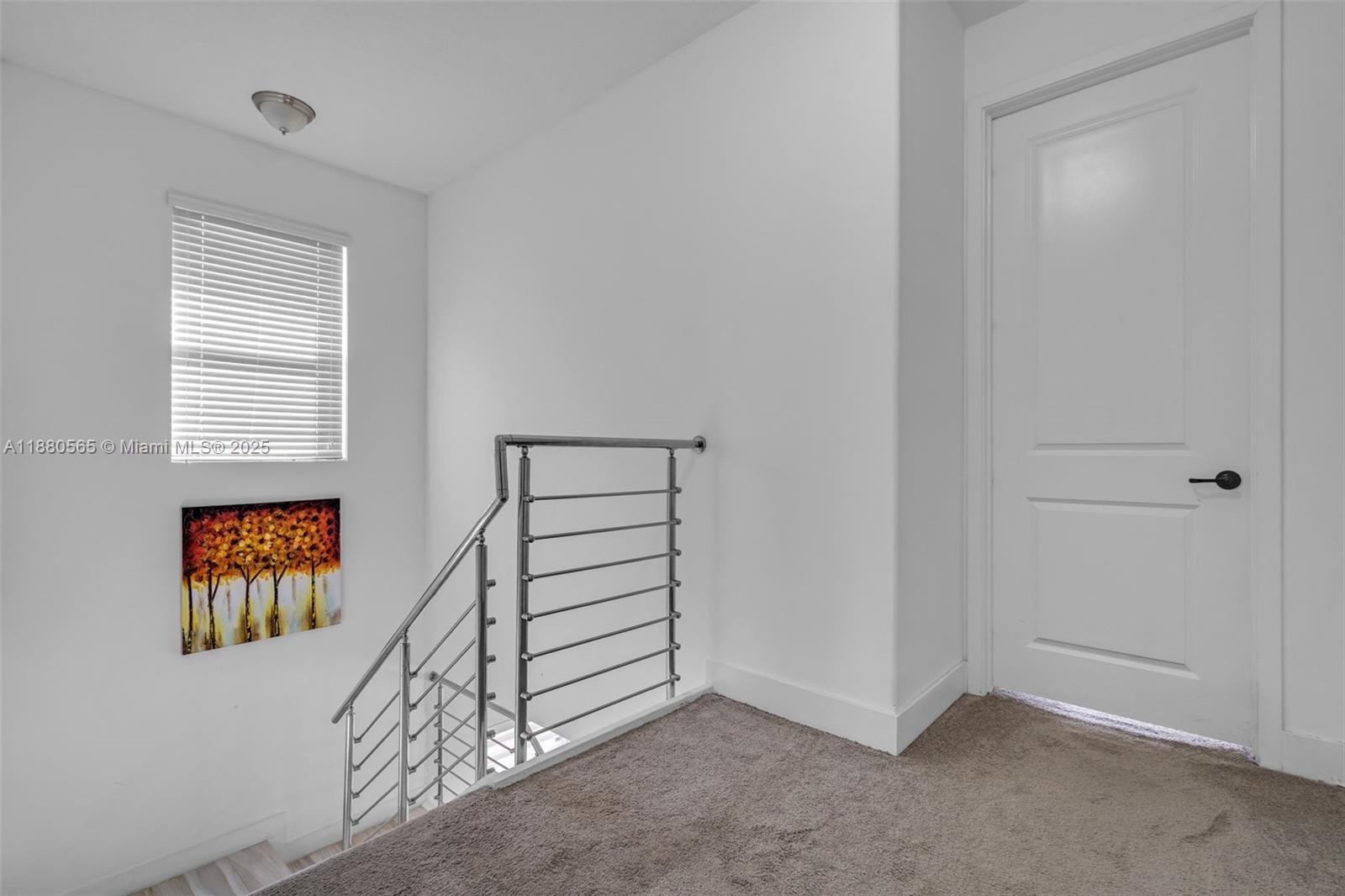 3332 West 95th Terrace, Unit 3332 Hialeah, FL 33018 - Photo 27 of 31 an empty room with windows and closet