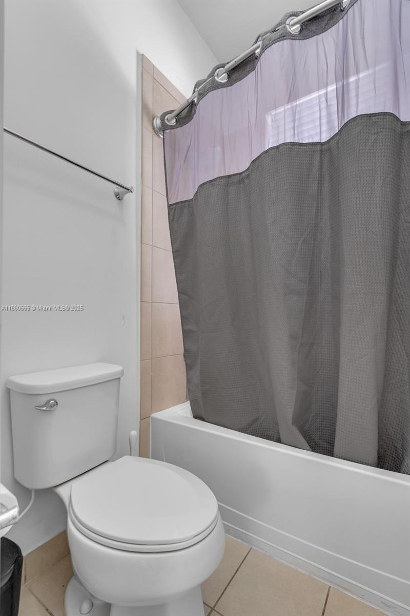 3332 West 95th Terrace, Unit 3332 Hialeah, FL 33018 - Photo 29 of 31 a bathroom with a sink and a toilet