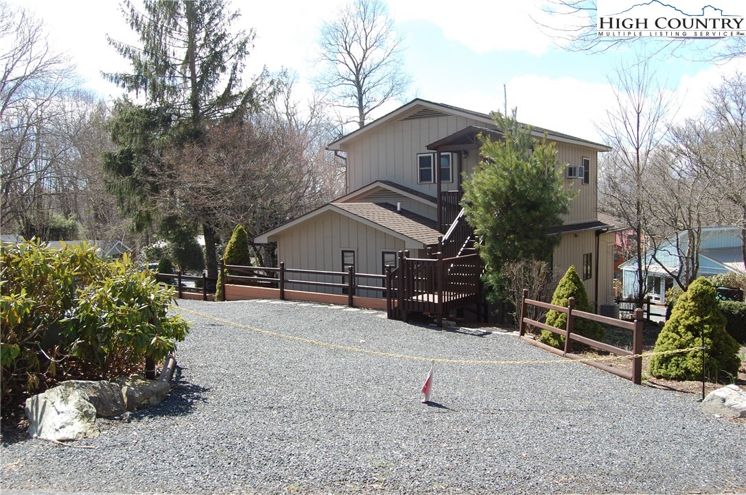 14 Briar Road Newland, NC 28657 - Photo 29 of 37 a white house that has a tree in front of it
