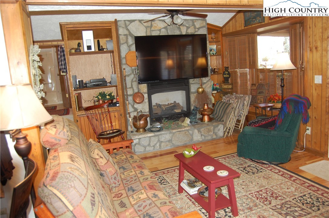 14 Briar Road Newland, NC 28657 - Photo 4 of 37 a living room with furniture and a flat screen tv