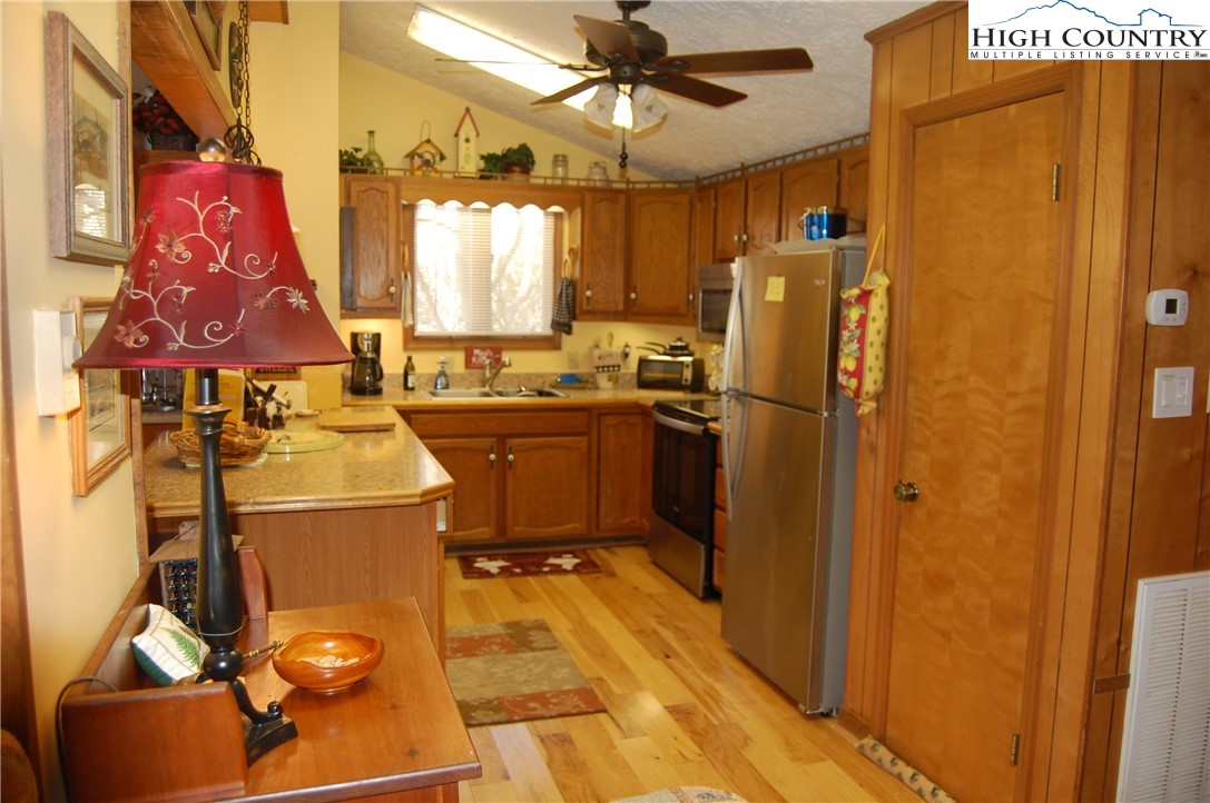 14 Briar Road Newland, NC 28657 - Photo 9 of 37 a kitchen with refrigerator and window