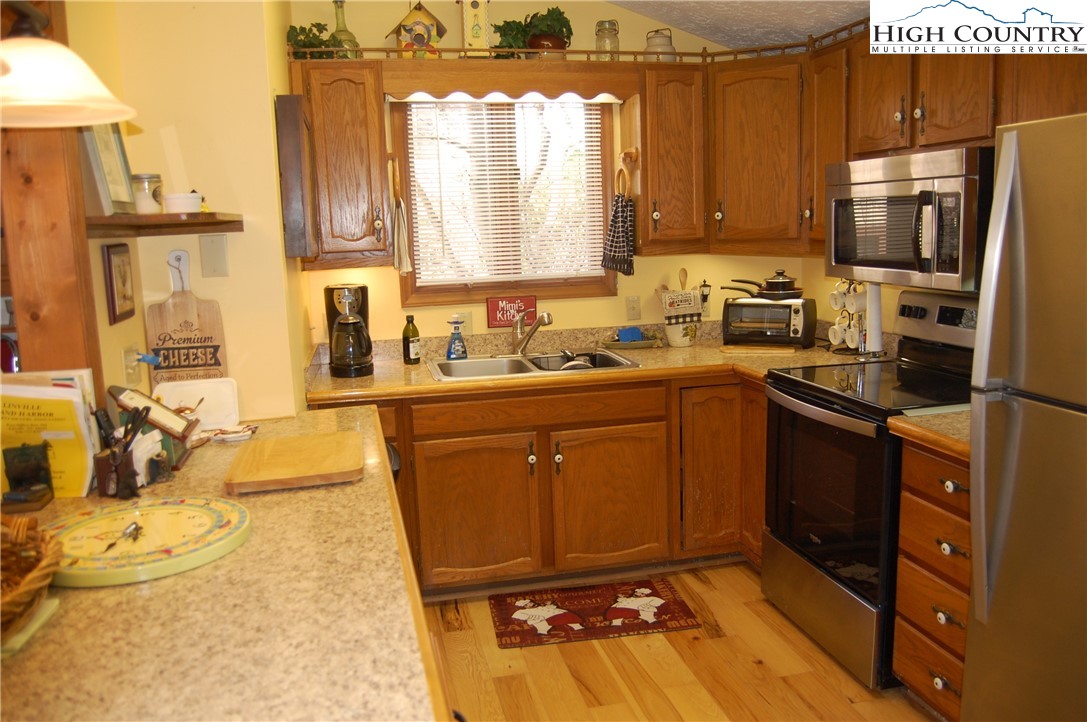 14 Briar Road Newland, NC 28657 - Photo 10 of 37 a kitchen with stainless steel appliances a sink stove and refrigerator