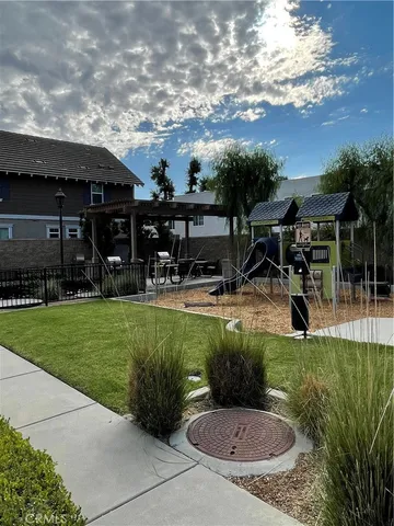 a backyard of a house with yard and outdoor seating