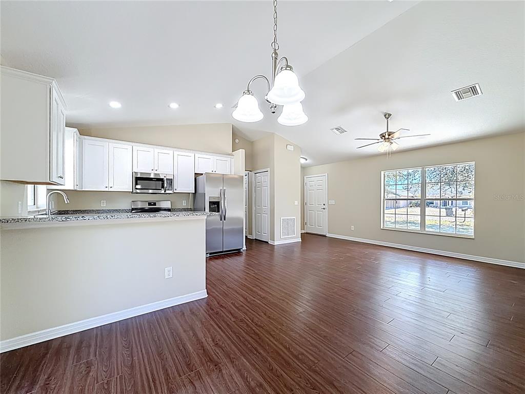 1314 Southwest 68th Avenue Bushnell, FL 33513 - Photo 19 of 33 a view of a kitchen with marble kitchen and stainless steel appliances