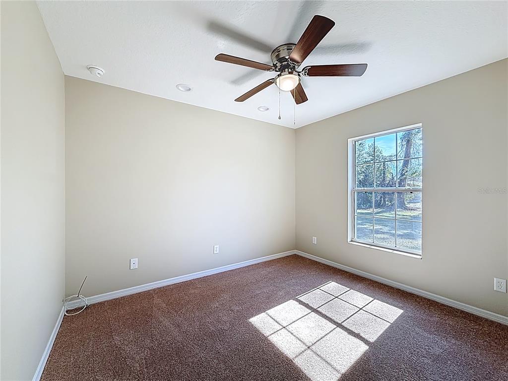 1314 Southwest 68th Avenue Bushnell, FL 33513 - Photo 32 of 33 a view of an empty room with a window