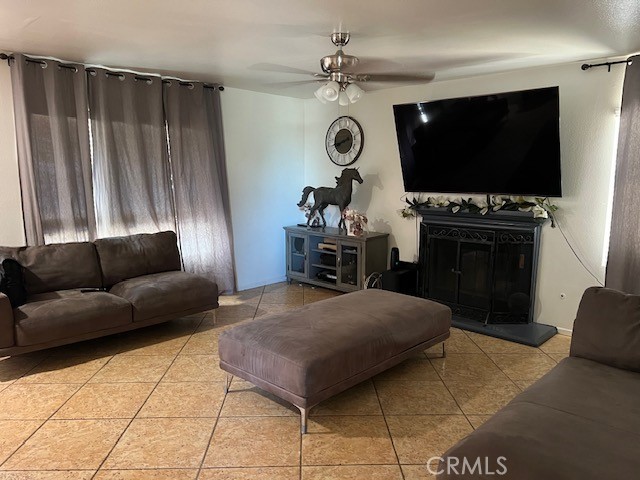 926 Hardwick Avenue Beaumont, CA 92223 - Photo 12 of 29 a living room with furniture and a flat screen tv