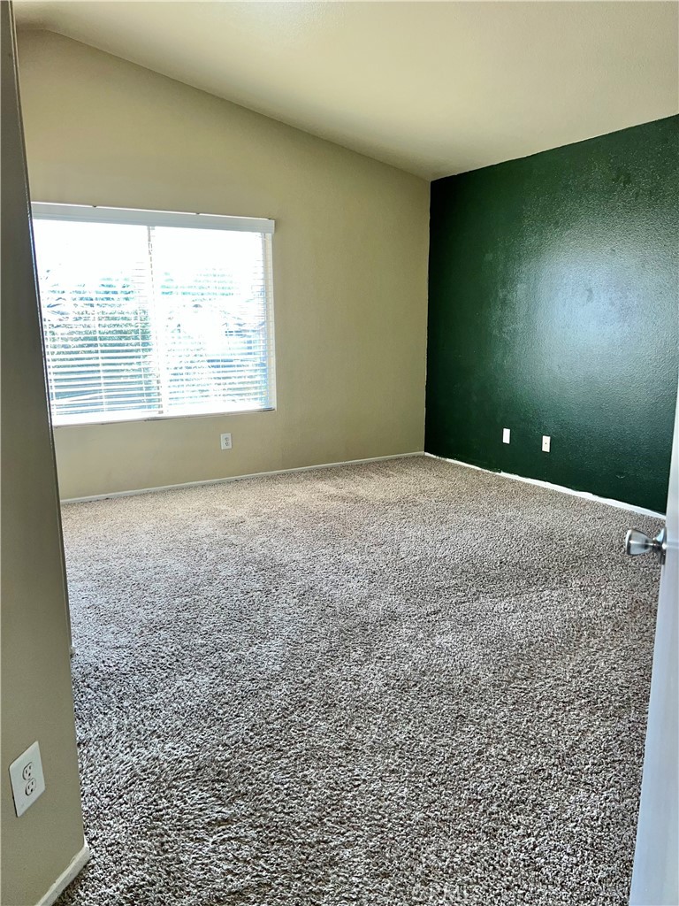 926 Hardwick Avenue Beaumont, CA 92223 - Photo 16 of 29 an empty room with a window