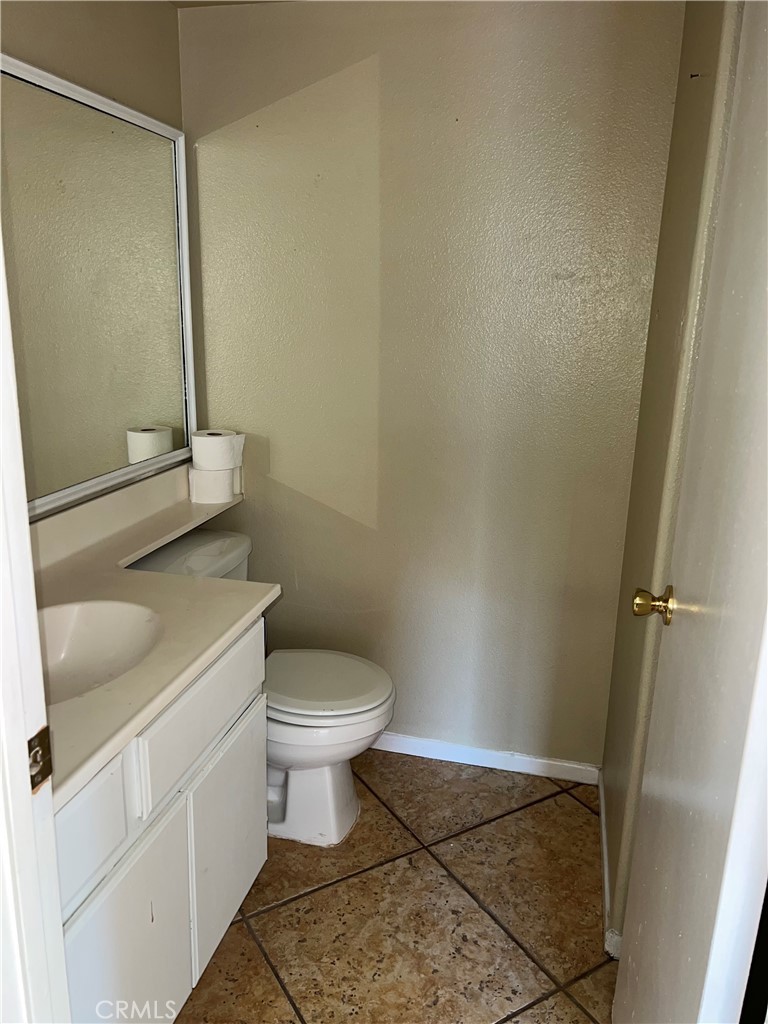926 Hardwick Avenue Beaumont, CA 92223 - Photo 18 of 29 a bathroom with a toilet and a sink