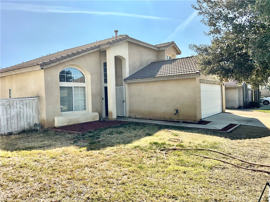 926 Hardwick Avenue Beaumont, CA 92223 - Photo 4 of 29 a front view of a house with a yard