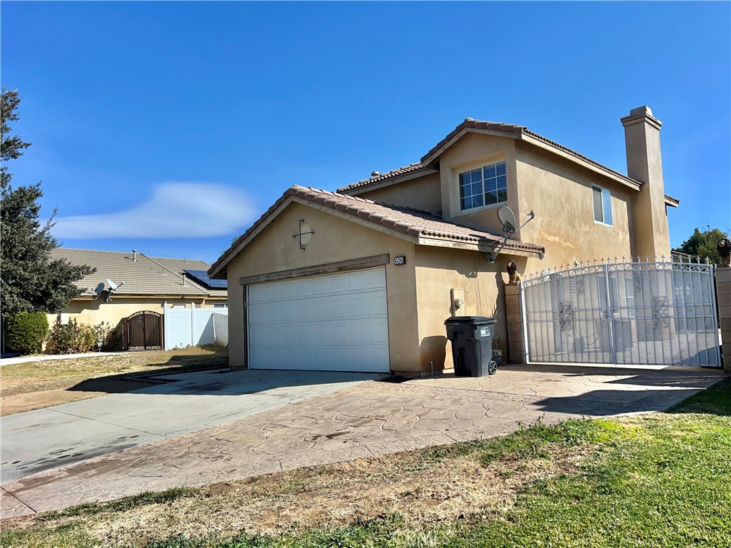 926 Hardwick Avenue Beaumont, CA 92223 - Photo 5 of 29 a front view of a house with a yard