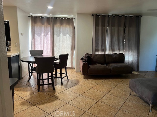 926 Hardwick Avenue Beaumont, CA 92223 - Photo 7 of 29 a living room with furniture and a flat screen tv