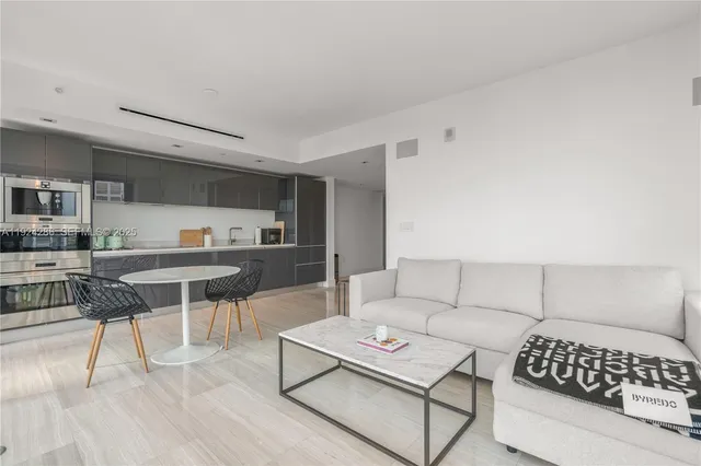 a bedroom with a bed and a chair