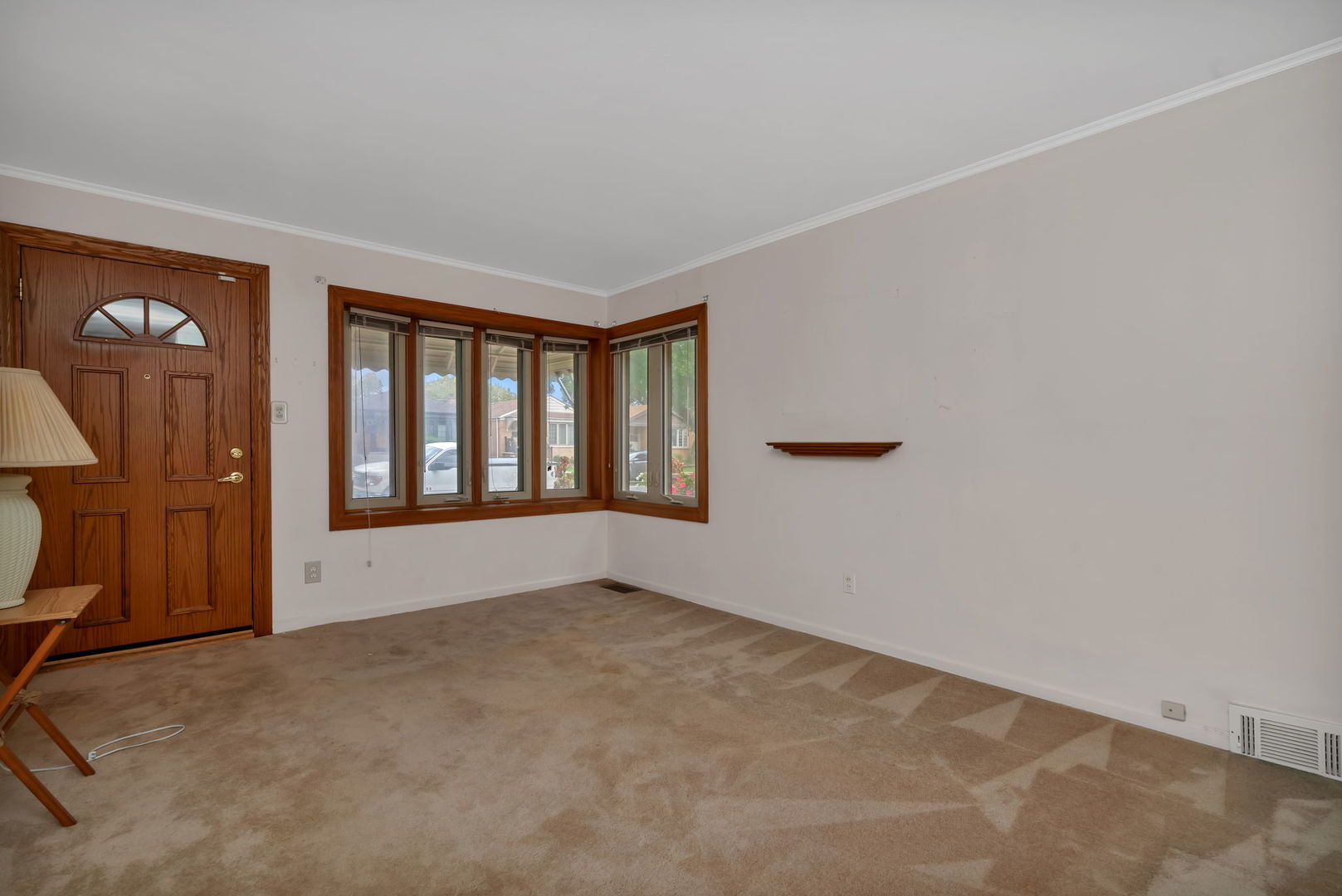 5611 South Monitor Avenue Chicago, IL 60638 - Photo 4 of 24 a view of an empty room with a window