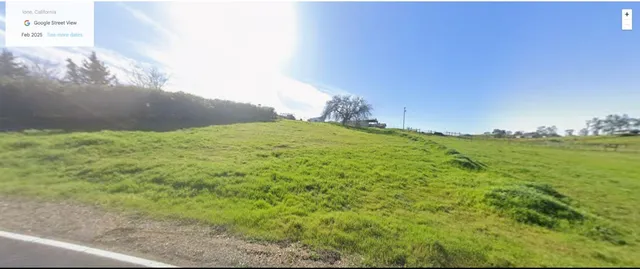 a view of a big yard with an outdoor space