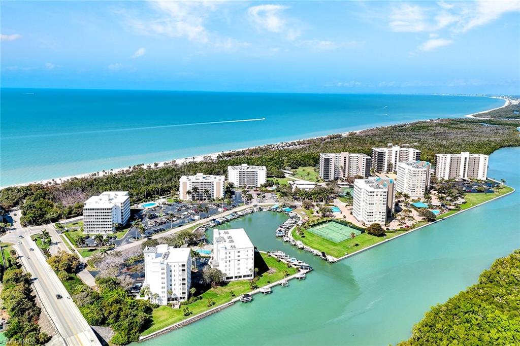 1 Bluebill Avenue, Unit 409 Naples, FL 34108 - Photo 18 of 25 a view of a city with an ocean