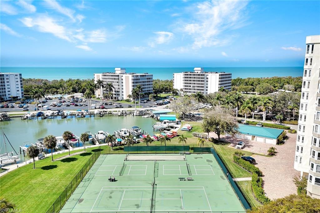 1 Bluebill Avenue, Unit 409 Naples, FL 34108 - Photo 23 of 25 a view of a city with an ocean view