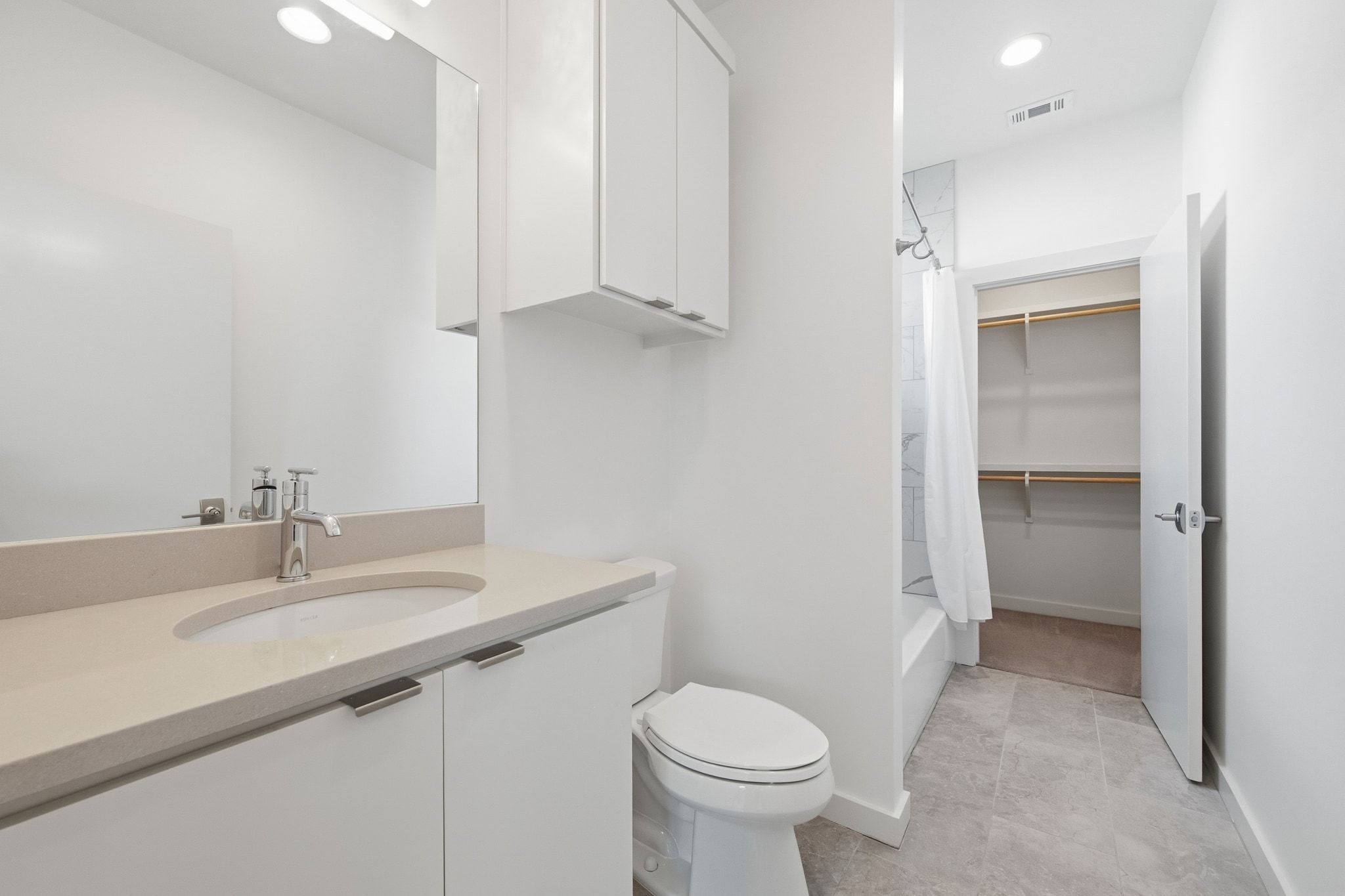 2811 Garwood Street, Unit B Austin, TX 78702 - Photo 23 of 24 Bathroom with shower / tub combo with curtain, vanity, recessed lighting, a spacious closet, and light tile patterned flooring