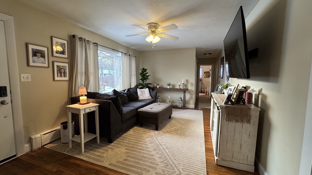 9 Rochambeau Street Fairhaven, MA 02719 - Photo 3 of 18 a living room with furniture and a flat screen tv