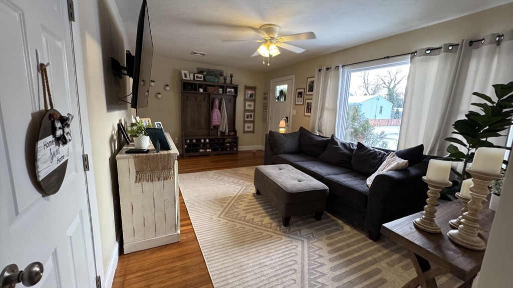 9 Rochambeau Street Fairhaven, MA 02719 - Photo 4 of 18 a living room with furniture and a window