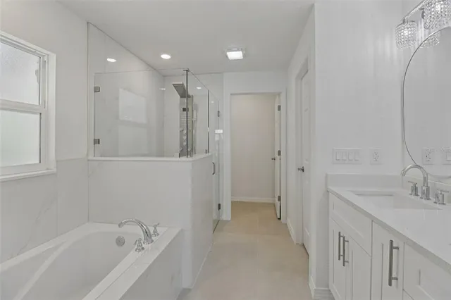 a bathroom with a bathtub and a sink