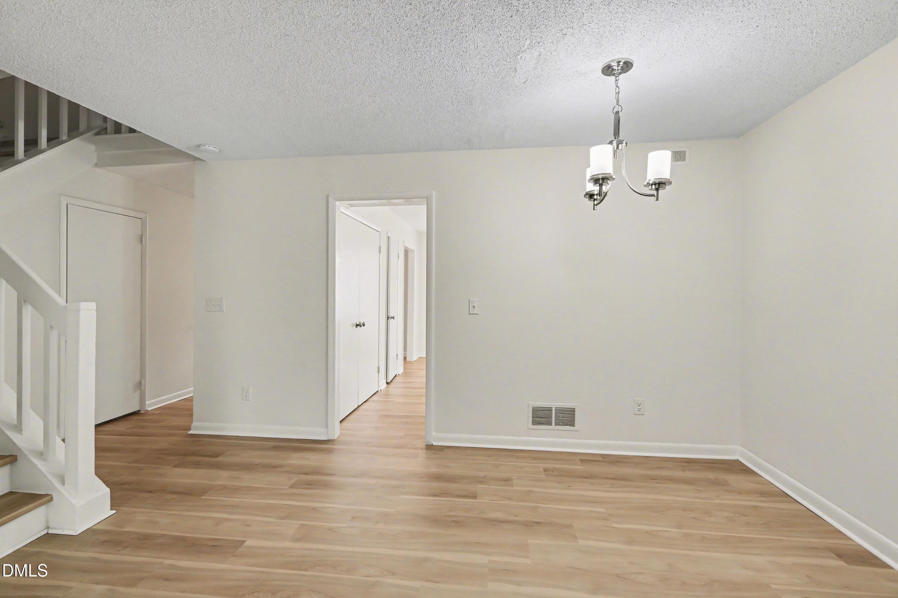 1304 Seaton Road, Unit 30 Durham, NC 27713 - Photo 15 of 25 a view of empty room with wooden floor