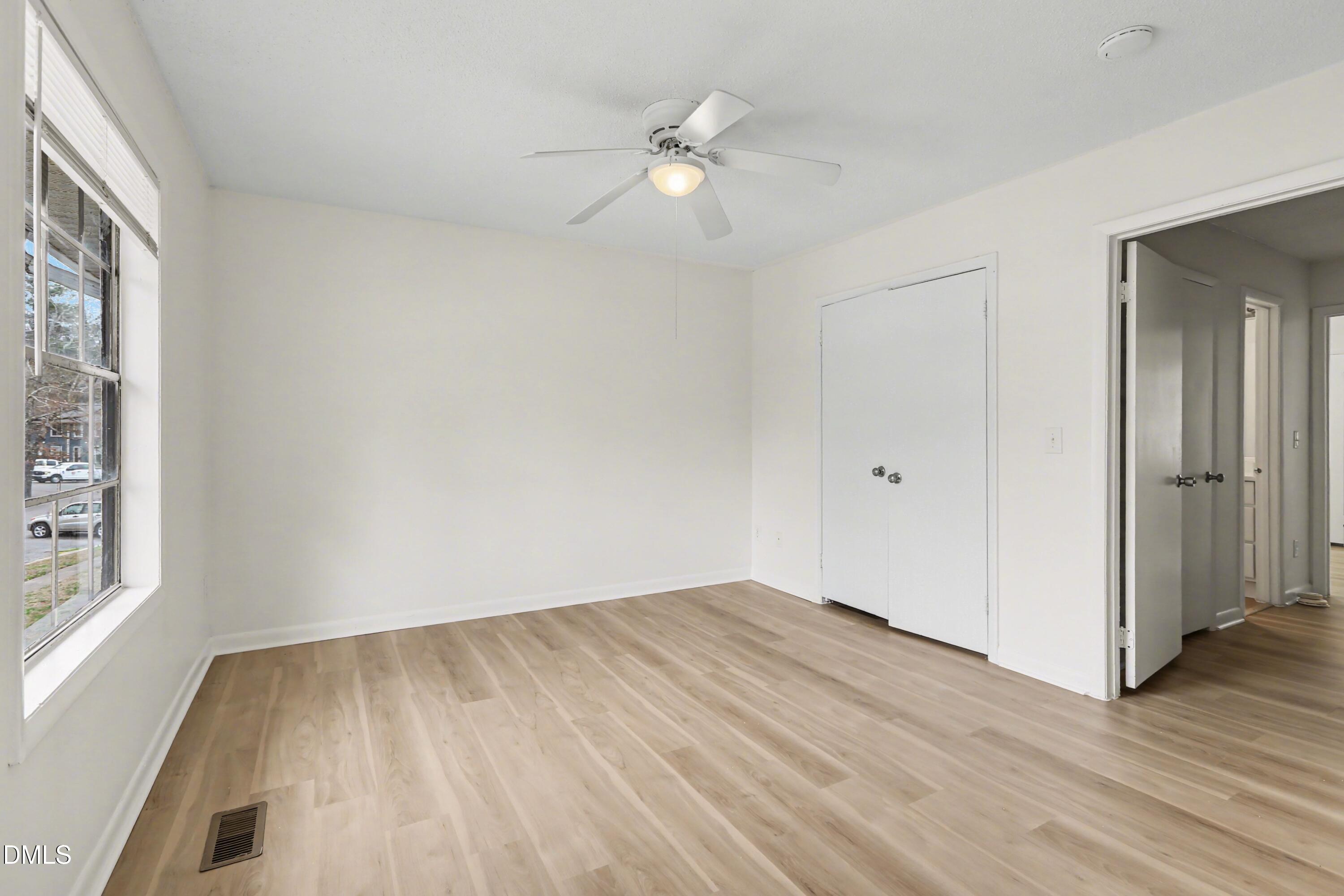 1304 Seaton Road, Unit 30 Durham, NC 27713 - Photo 20 of 25 wooden floor in an empty room with a window