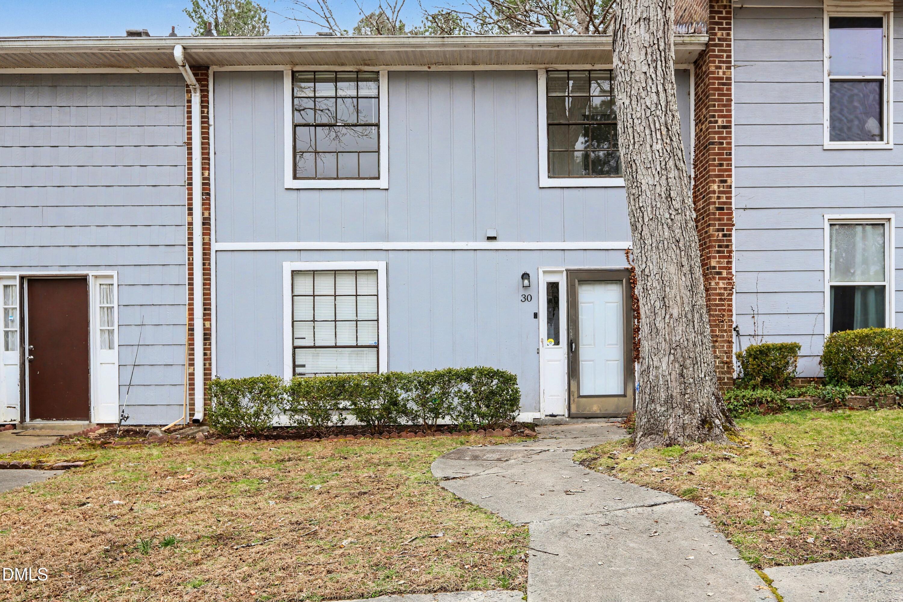 1304 Seaton Road, Unit 30 Durham, NC 27713 - Photo 2 of 25 a front view of a house
