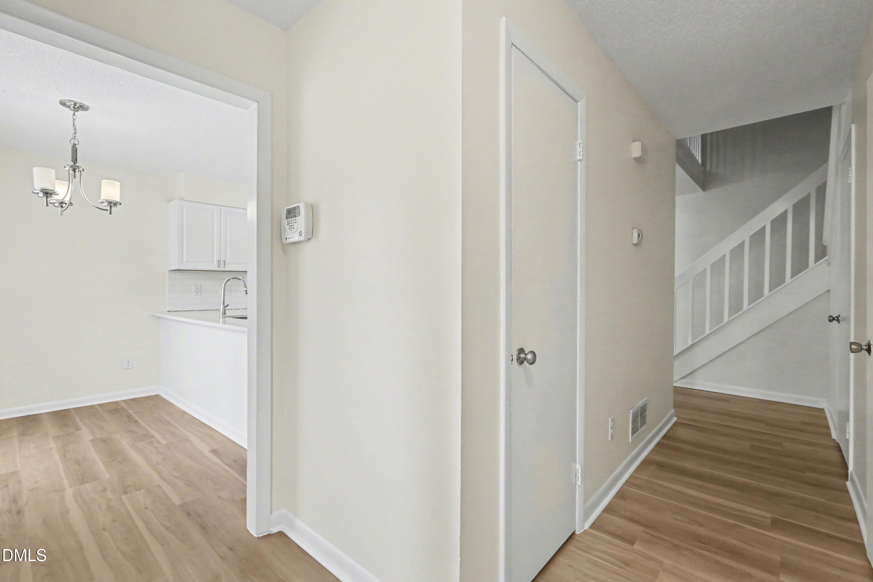 1304 Seaton Road, Unit 30 Durham, NC 27713 - Photo 5 of 25 a view of a hallway with wooden floor and entryway