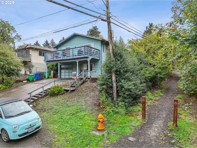 a front view of a house with a yard table and chairs