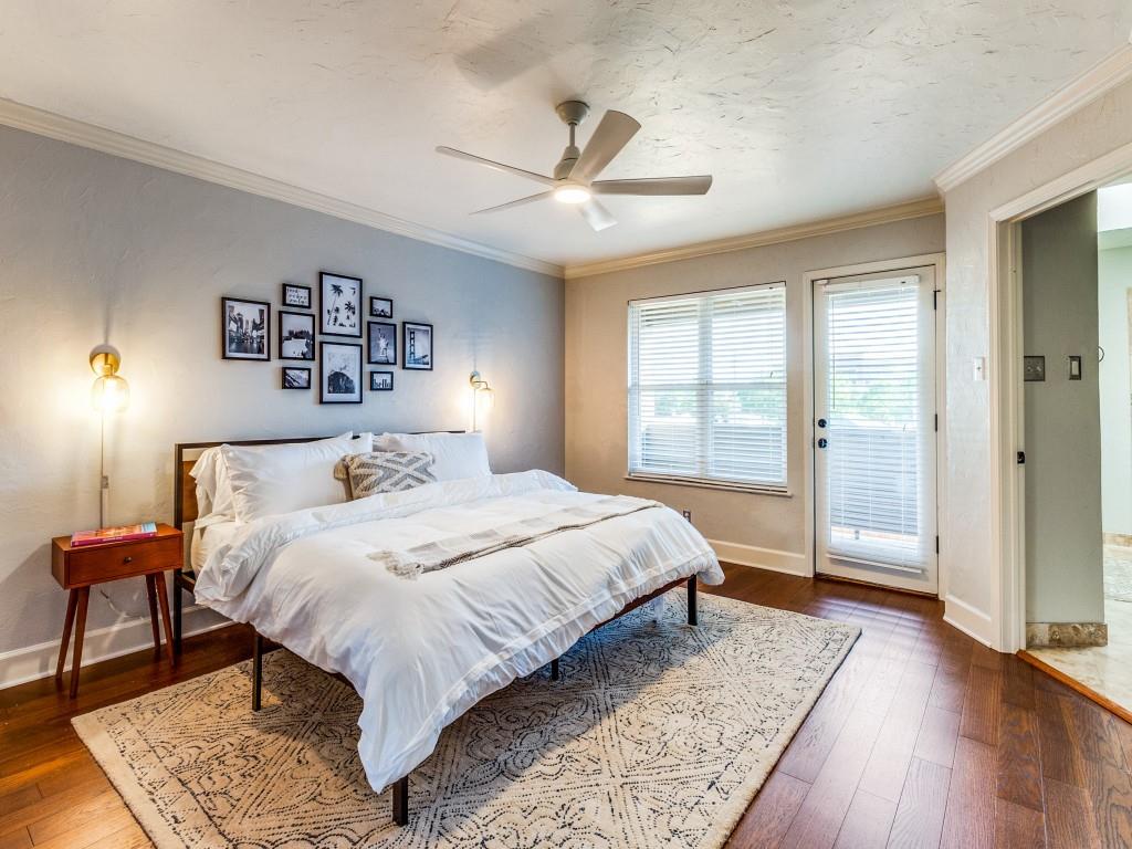 531 Josephine Street Dallas, TX 75246 - Photo 12 of 25 a bedroom with a large bed and a window