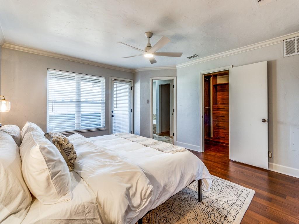 531 Josephine Street Dallas, TX 75246 - Photo 13 of 25 a bedroom with a large bed and a window