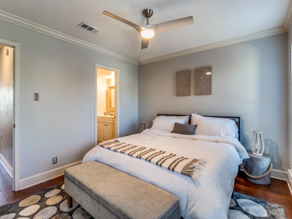 531 Josephine Street Dallas, TX 75246 - Photo 20 of 25 a bedroom with a bed and window