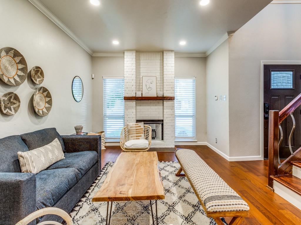 531 Josephine Street Dallas, TX 75246 - Photo 5 of 25 a living room with furniture and a fireplace