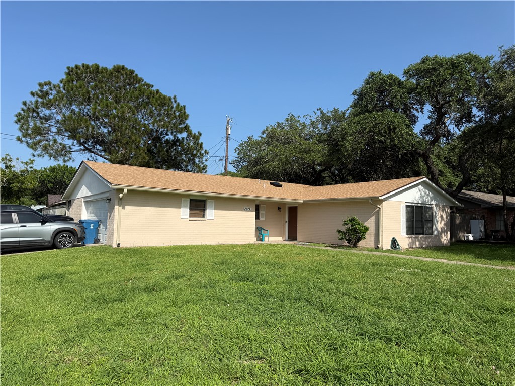 2124 Westwind Circle Ingleside, TX 78362 - Photo 20 of 20 a view of a house with a yard and garage