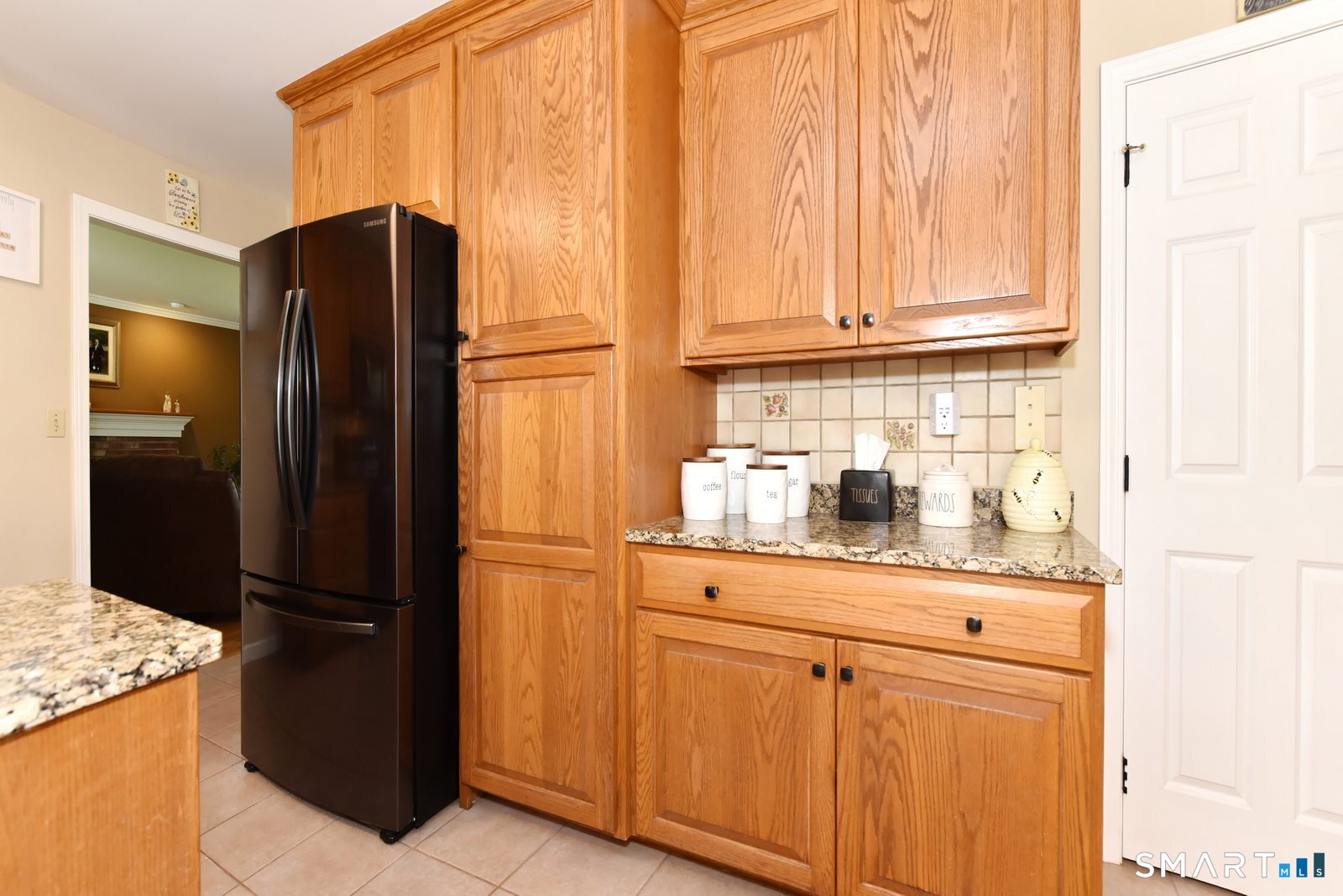 31 North Maple Street East Hampton, CT 06424 - Photo 11 of 38 a kitchen with stainless steel appliances granite countertop a refrigerator and a stove