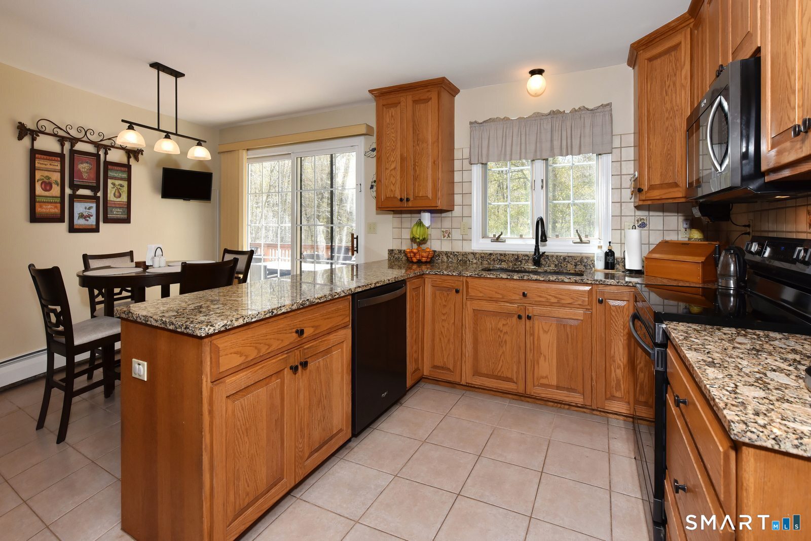 31 North Maple Street East Hampton, CT 06424 - Photo 15 of 38 a kitchen with stainless steel appliances granite countertop a sink counter space stove and cabinets
