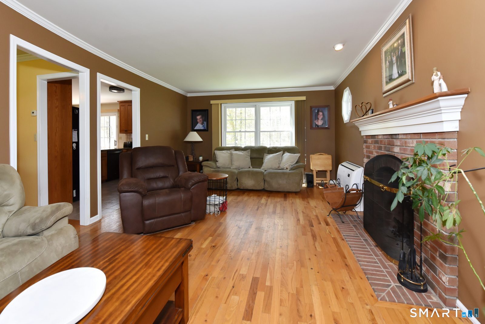 31 North Maple Street East Hampton, CT 06424 - Photo 19 of 38 a living room with furniture and a fireplace