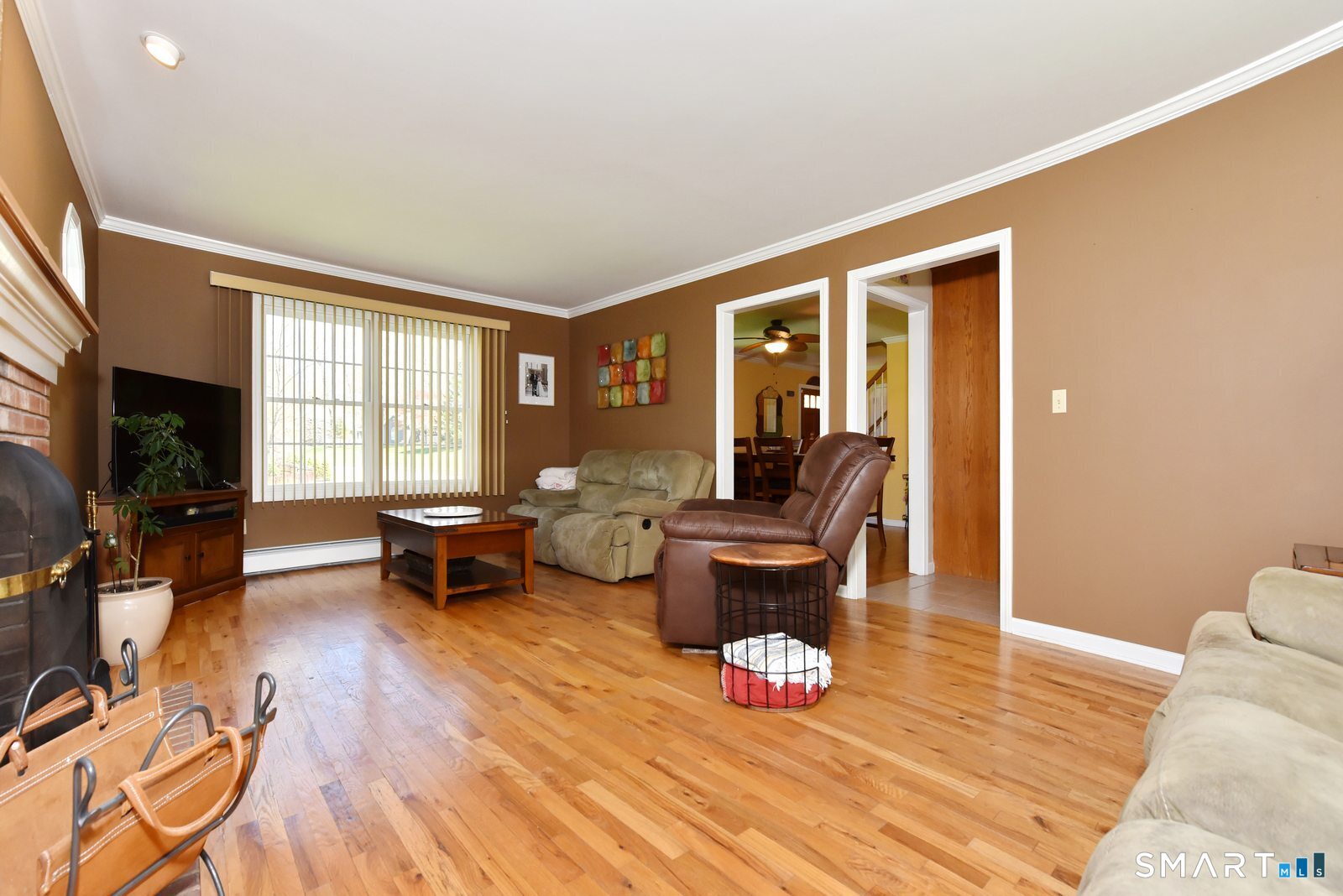 31 North Maple Street East Hampton, CT 06424 - Photo 20 of 38 a living room with furniture and a flat screen tv with wooden floor