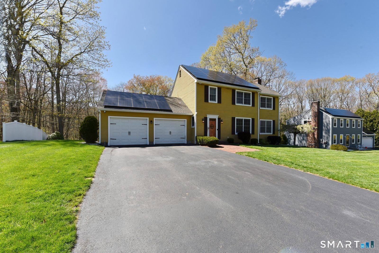 31 North Maple Street East Hampton, CT 06424 - Photo 2 of 38 a front view of a house with a yard and garage