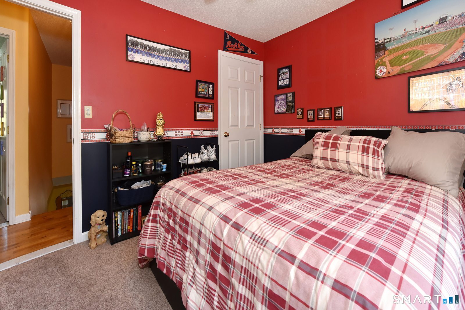 31 North Maple Street East Hampton, CT 06424 - Photo 21 of 38 a bedroom with a bed and a lamp on dresser
