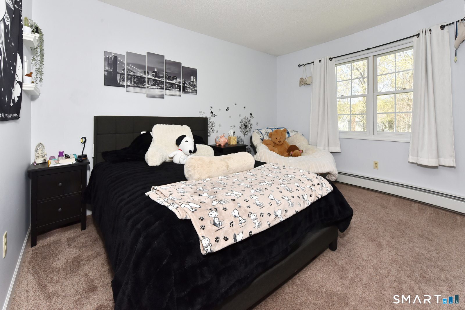 31 North Maple Street East Hampton, CT 06424 - Photo 22 of 38 a bed sitting in a bedroom next to a window