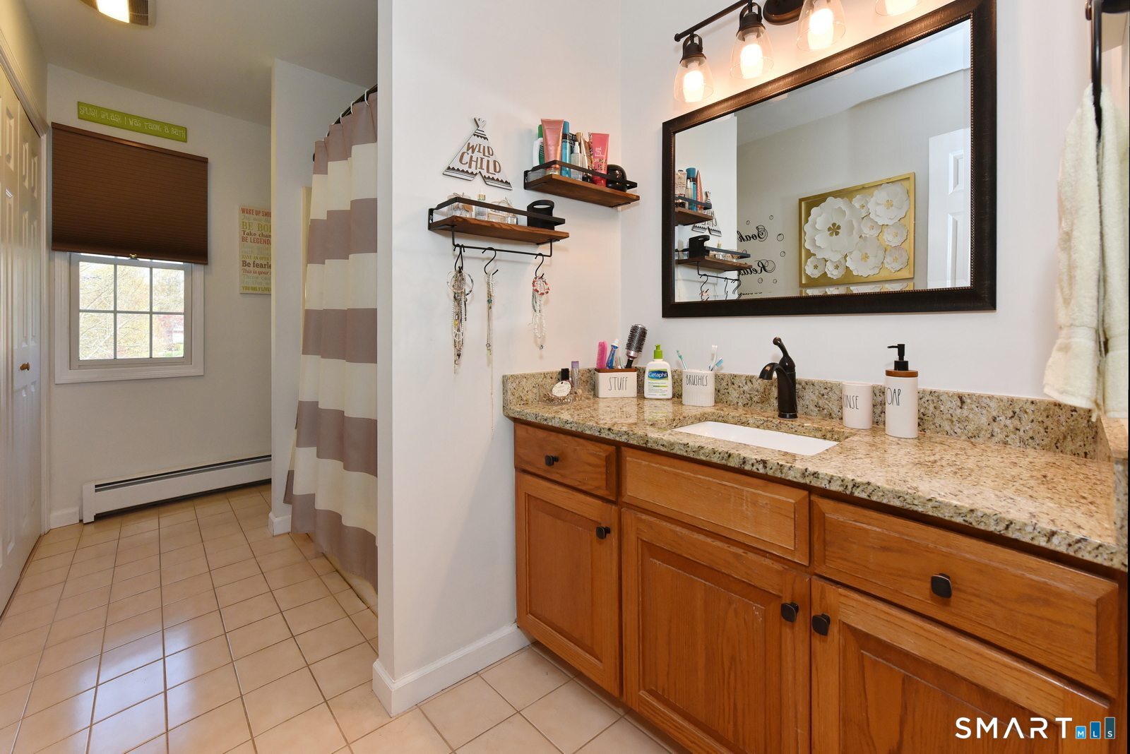 31 North Maple Street East Hampton, CT 06424 - Photo 24 of 38 a bathroom with a sink a vanity and a mirror