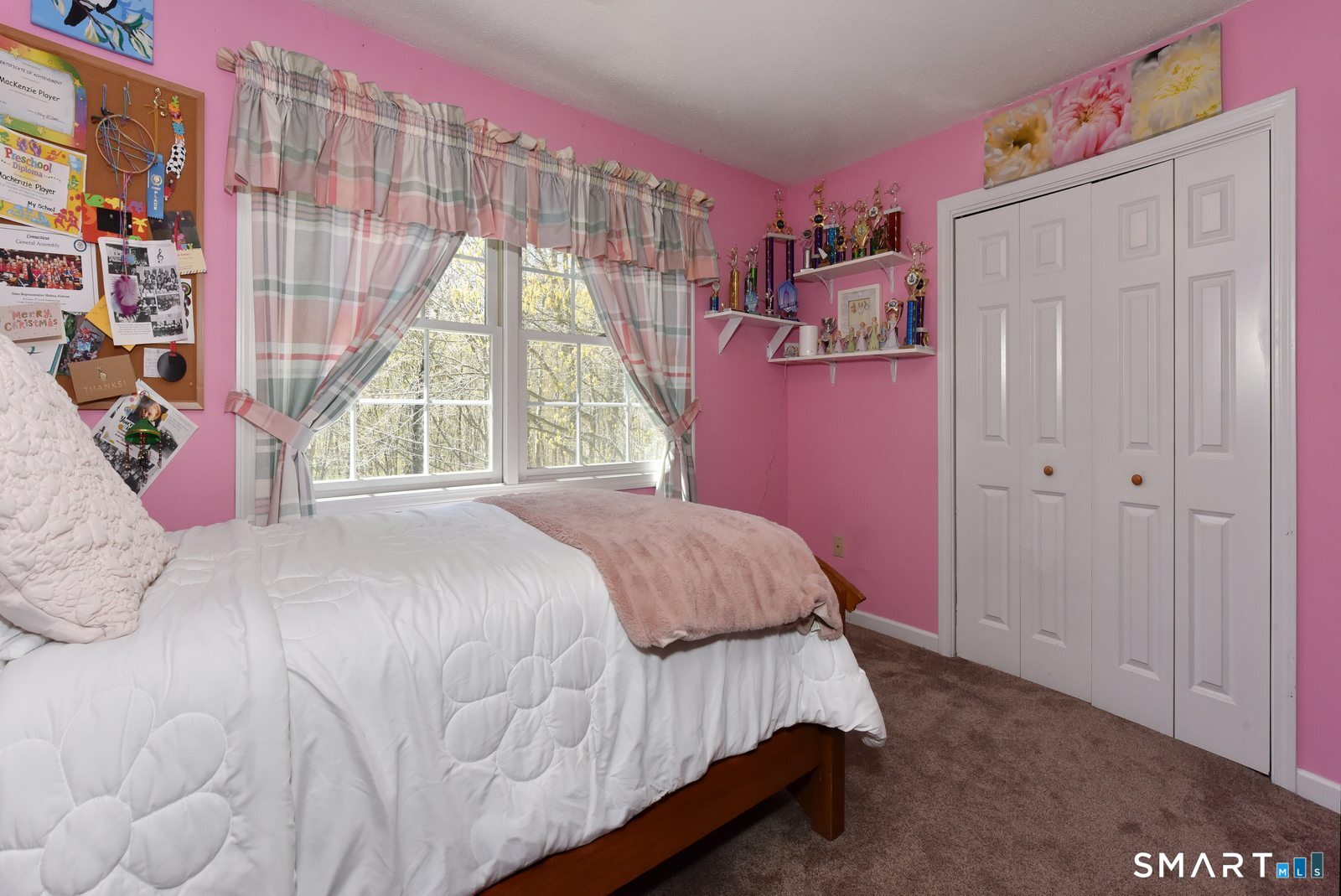 31 North Maple Street East Hampton, CT 06424 - Photo 25 of 38 a bed sitting in a bedroom next to a window