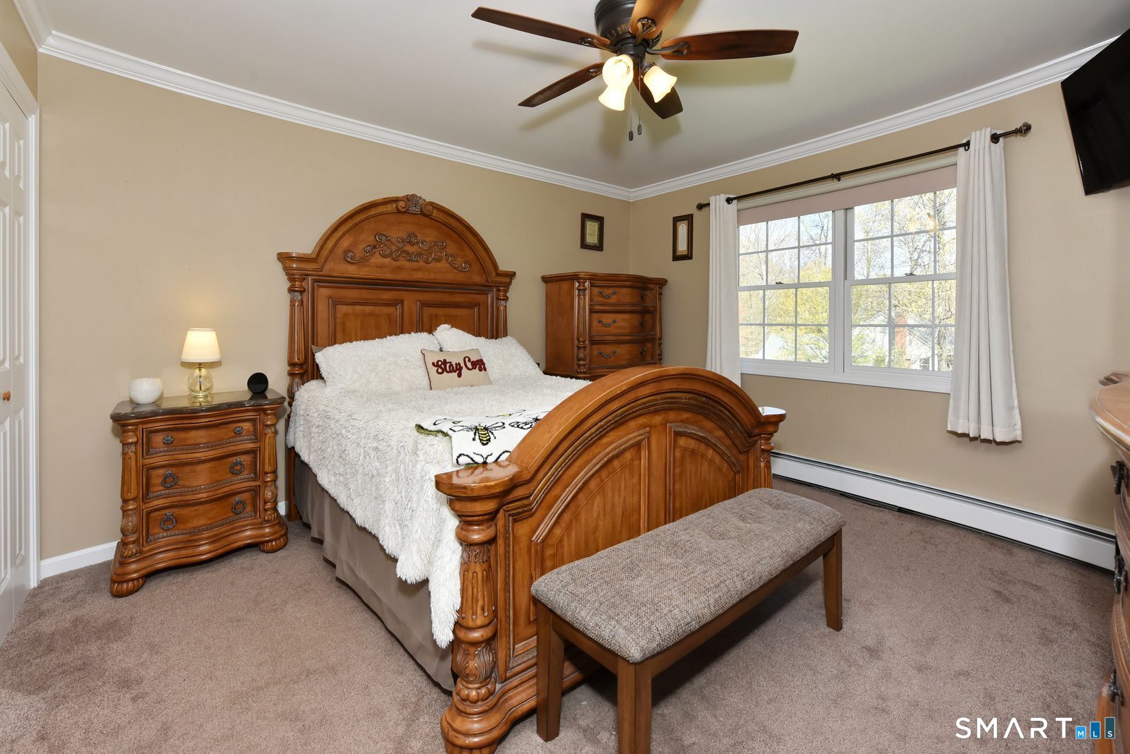 31 North Maple Street East Hampton, CT 06424 - Photo 27 of 38 a bedroom with a bed and a chandelier