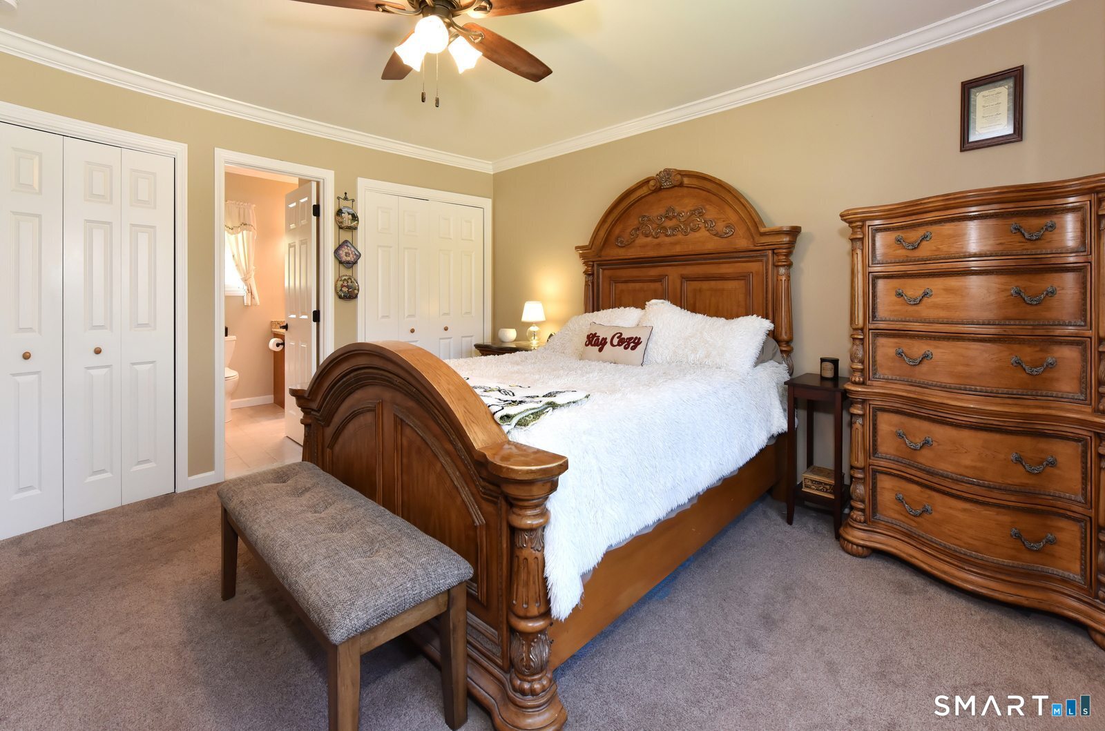 31 North Maple Street East Hampton, CT 06424 - Photo 29 of 38 a bedroom with a bed and a chandelier